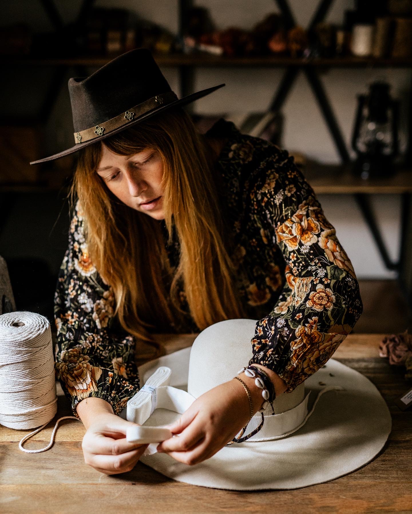 Crown of the Vagabond hatter Ruth trying out different designs for a custom ordered hat