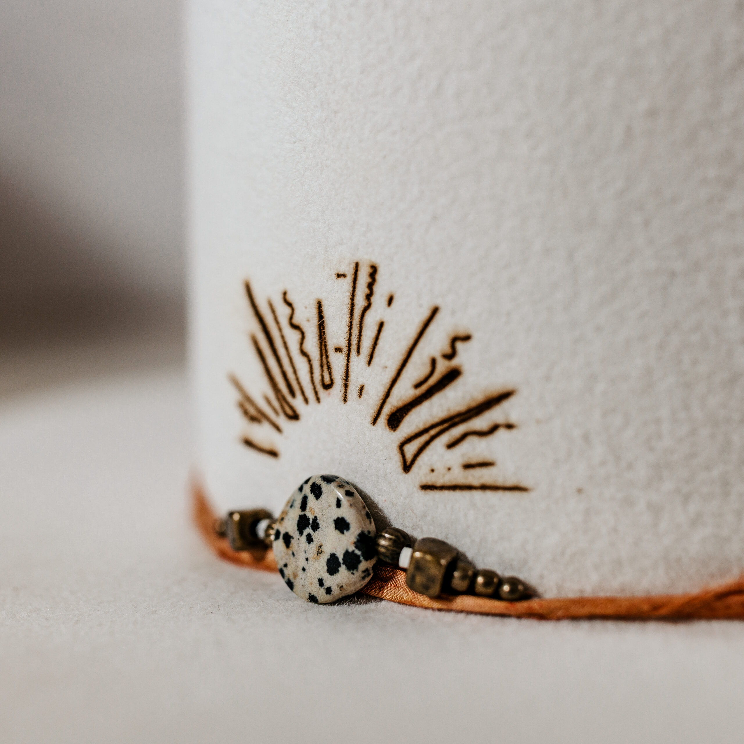 A beautifully handcrafted Crown of the Vagabond hat by the hatters Ruth and Chris on Mallorca with traditional tools in the color Snow shaped in Venice with a clean stunning look. The design is made of copper-colored sari silk and a centred build up stone threat highlighted with a handdrawn custom laser branding. The hat has a clean flat 10cm/3.94in brim and is branded with the serial number 30 on the sweatband.