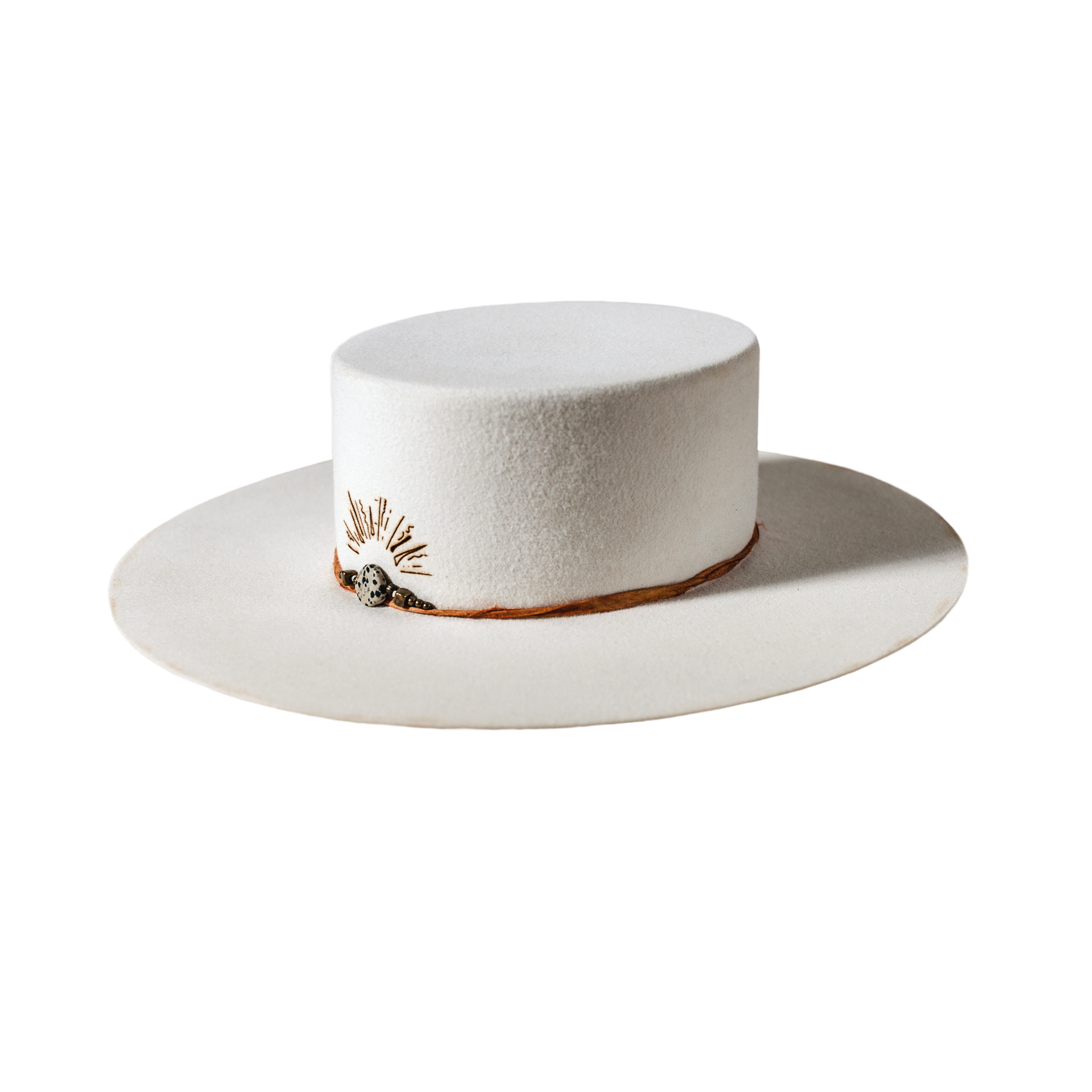 A beautifully handcrafted Crown of the Vagabond hat by the hatters Ruth and Chris on Mallorca with traditional tools in the color Snow shaped in Venice with a clean stunning look. The design is made of copper-colored sari silk and a centred build up stone threat highlighted with a handdrawn custom laser branding. The hat has a clean flat 10cm/3.94in brim and is branded with the serial number 30 on the sweatband.