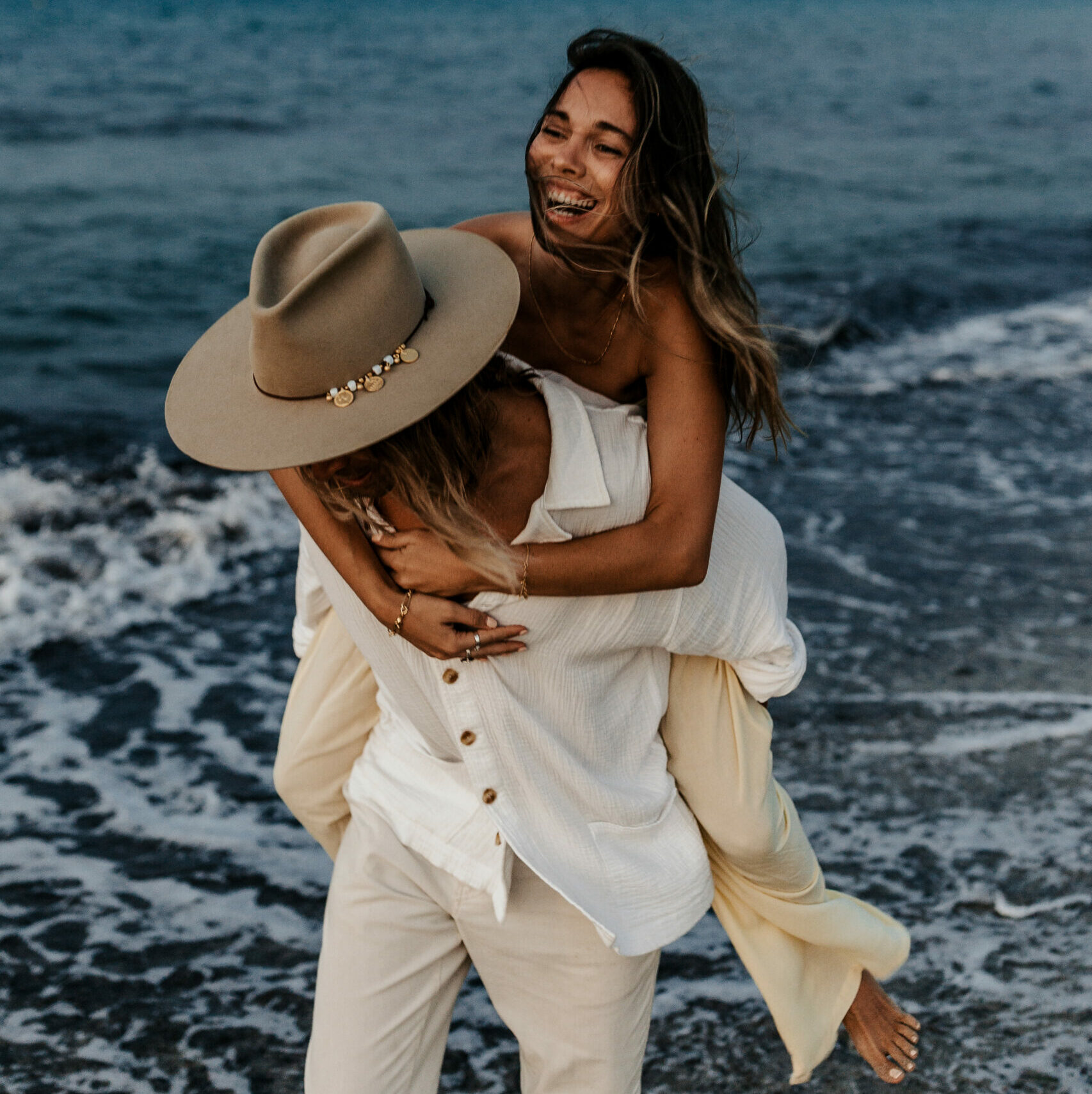 Neri and Manu wearing Crown of the Vagabond hats on Mallorca
