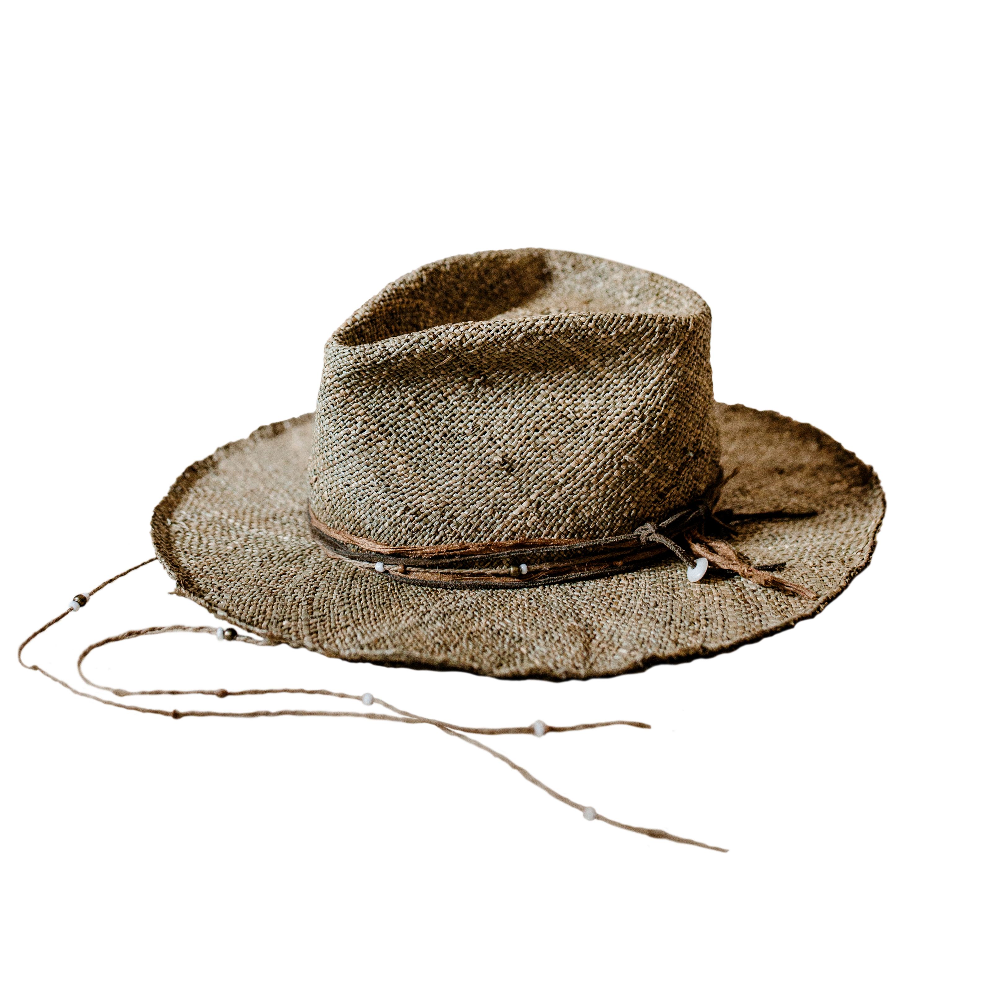 Crown of the Vagabond Hat on Mallorca in Straw Gold-Digger-shaped. Onshore breeze livestyle inspired design with Shells, Rustic Elements, Sari Silk and Leather.